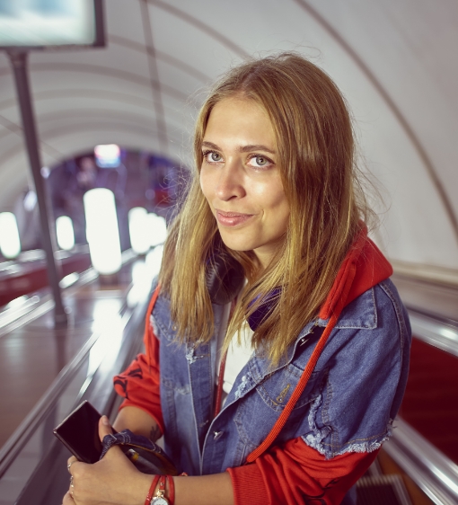 Woman on escalator underground