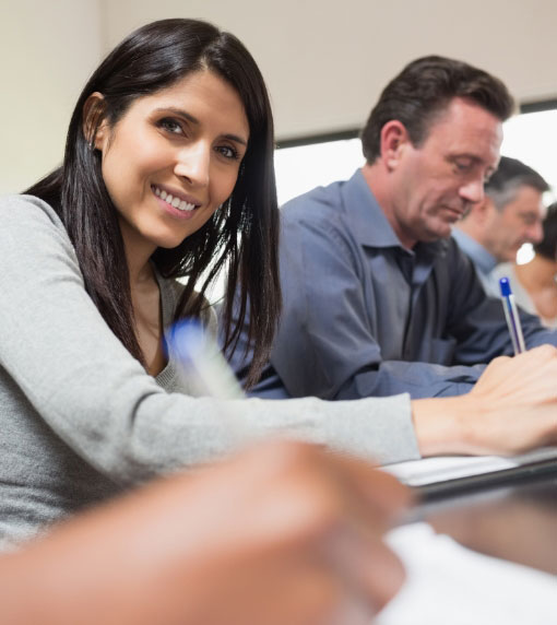 Woman smiling in a classroom